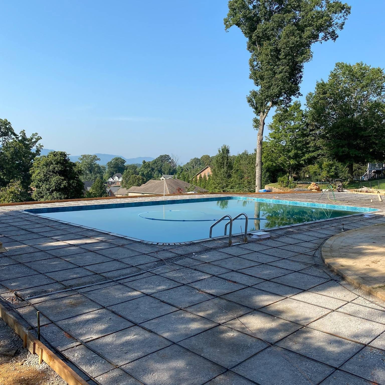 Bonded pool deck rebar and equipment ready for inspection at an East Tennessee home