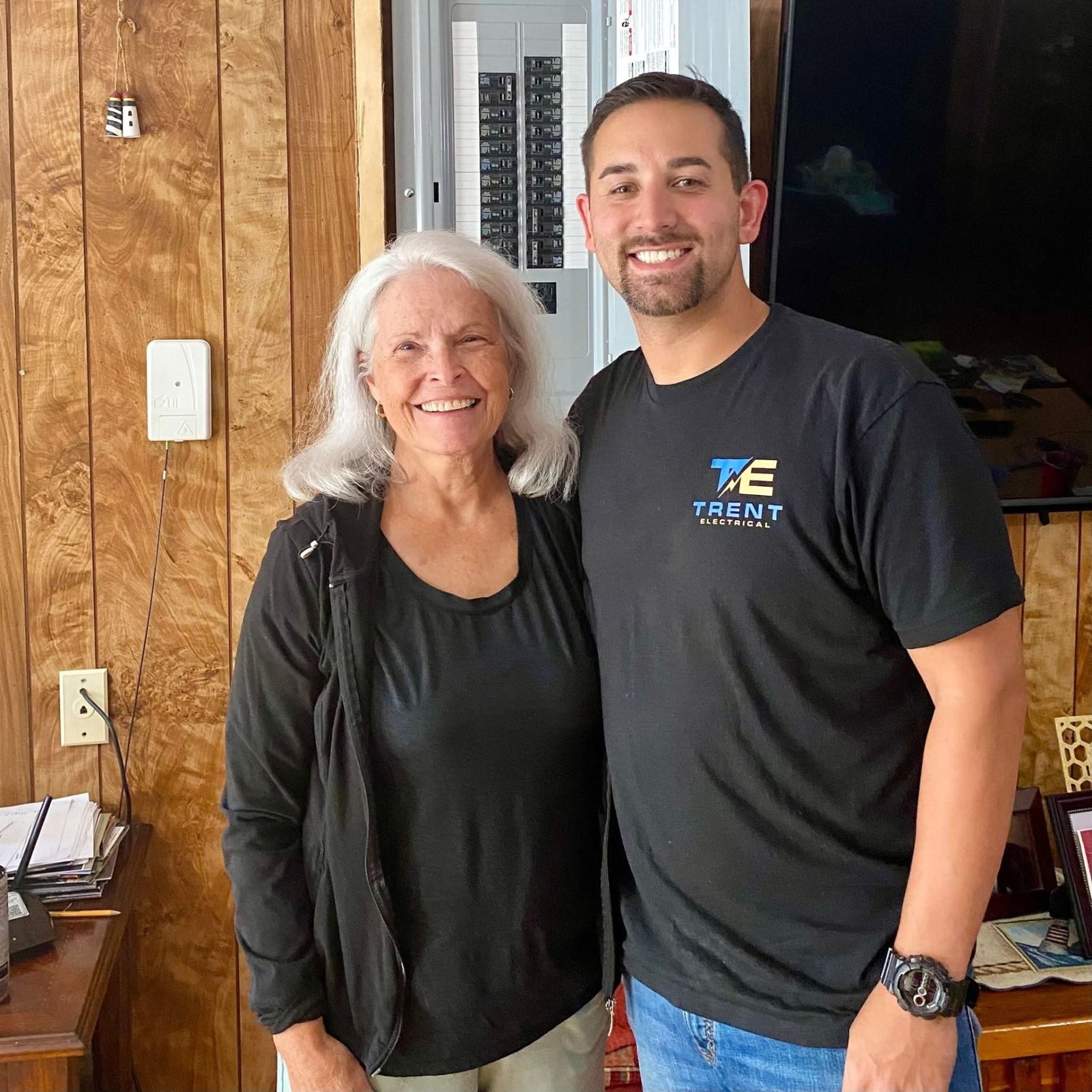 Ryan Trent with a long-time customer in her home