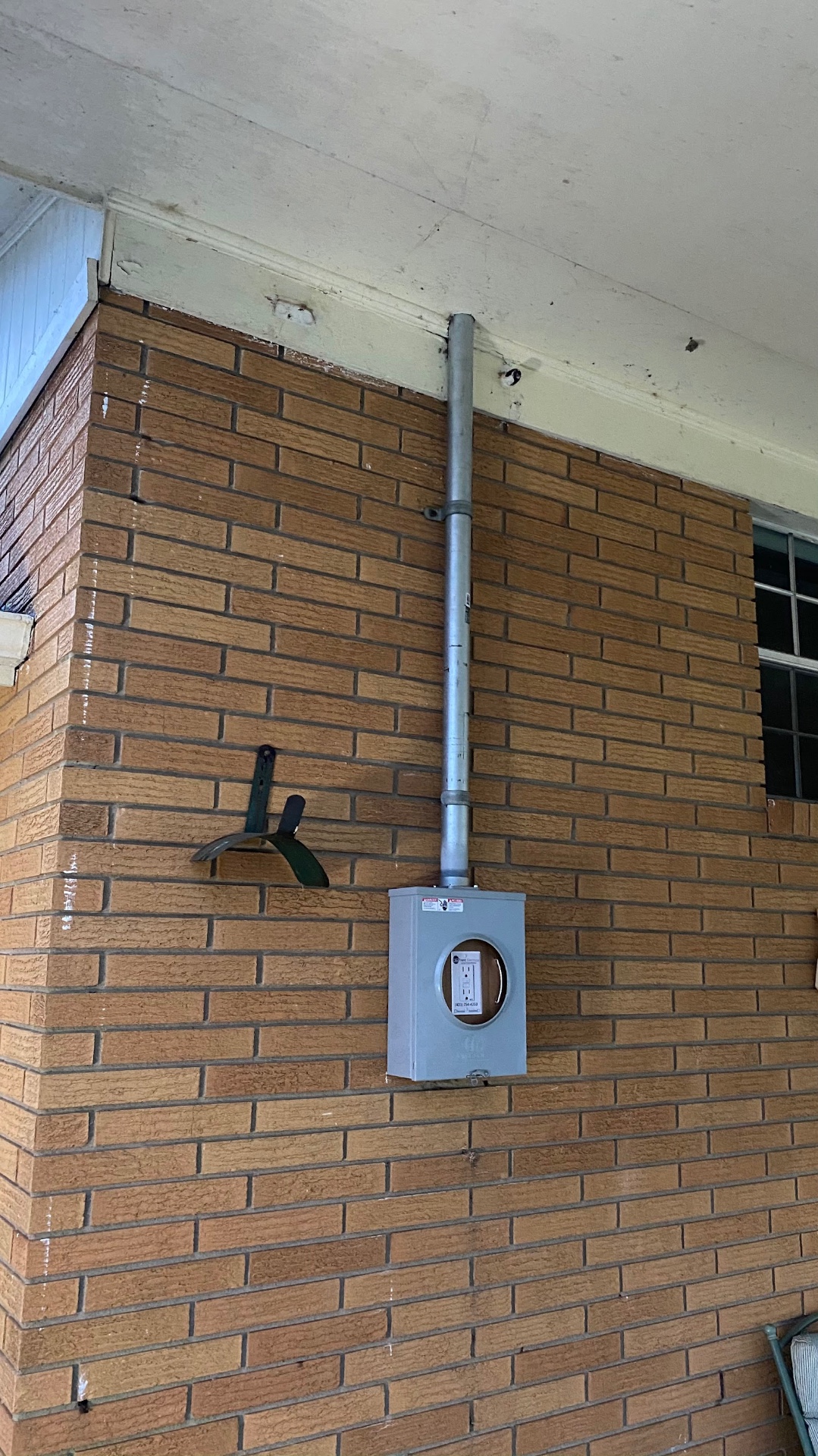 Outdoor electrical meter box on a brick home in Surgoinsville TN