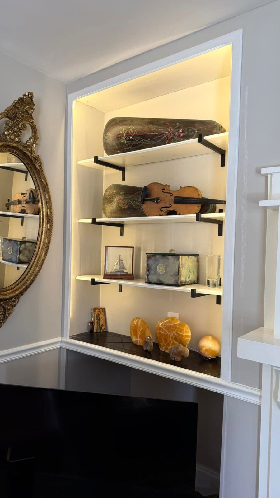 Built-in recessed shelving with integrated LED accent lighting