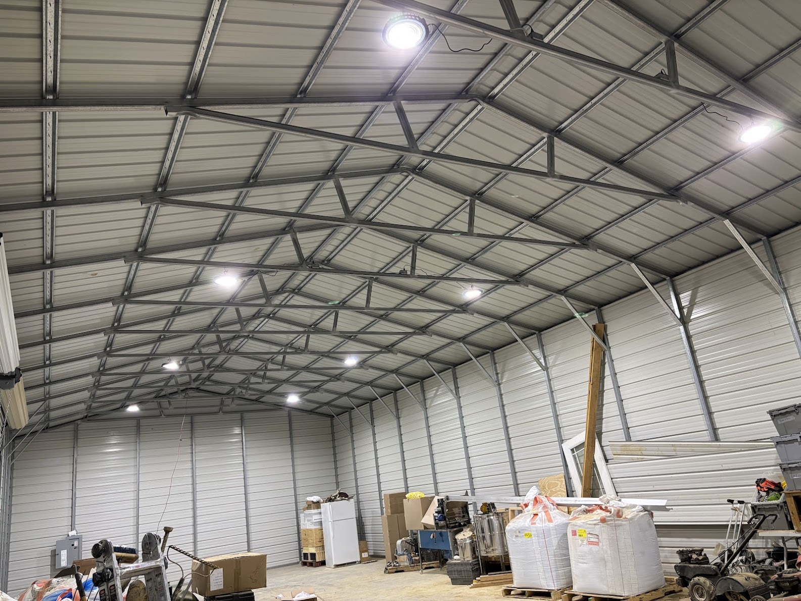 LED high-bay lighting installed in a metal garage by Trent Electrical