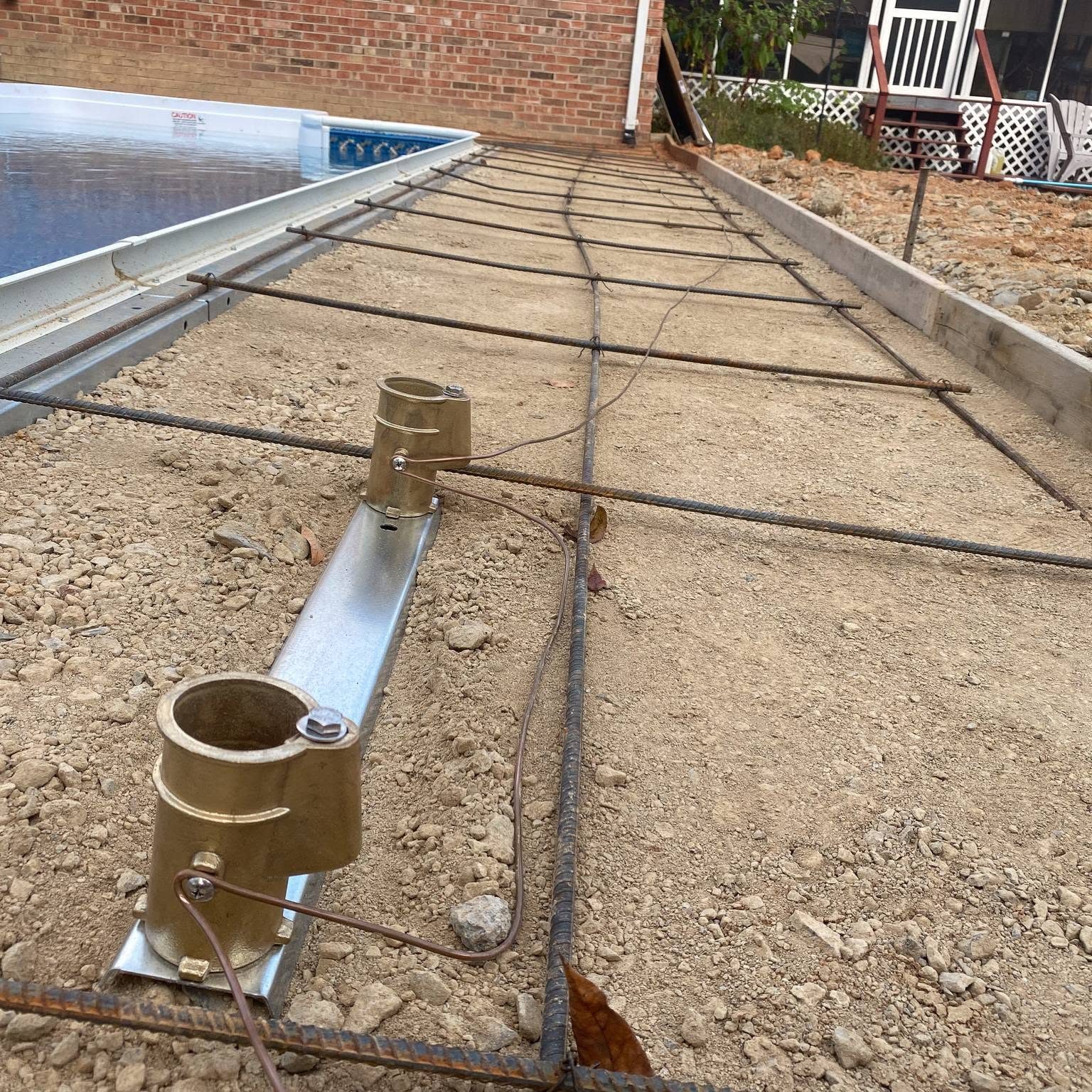 Pool deck bonding grid with handrail sockets bonded to rebar before the concrete pour