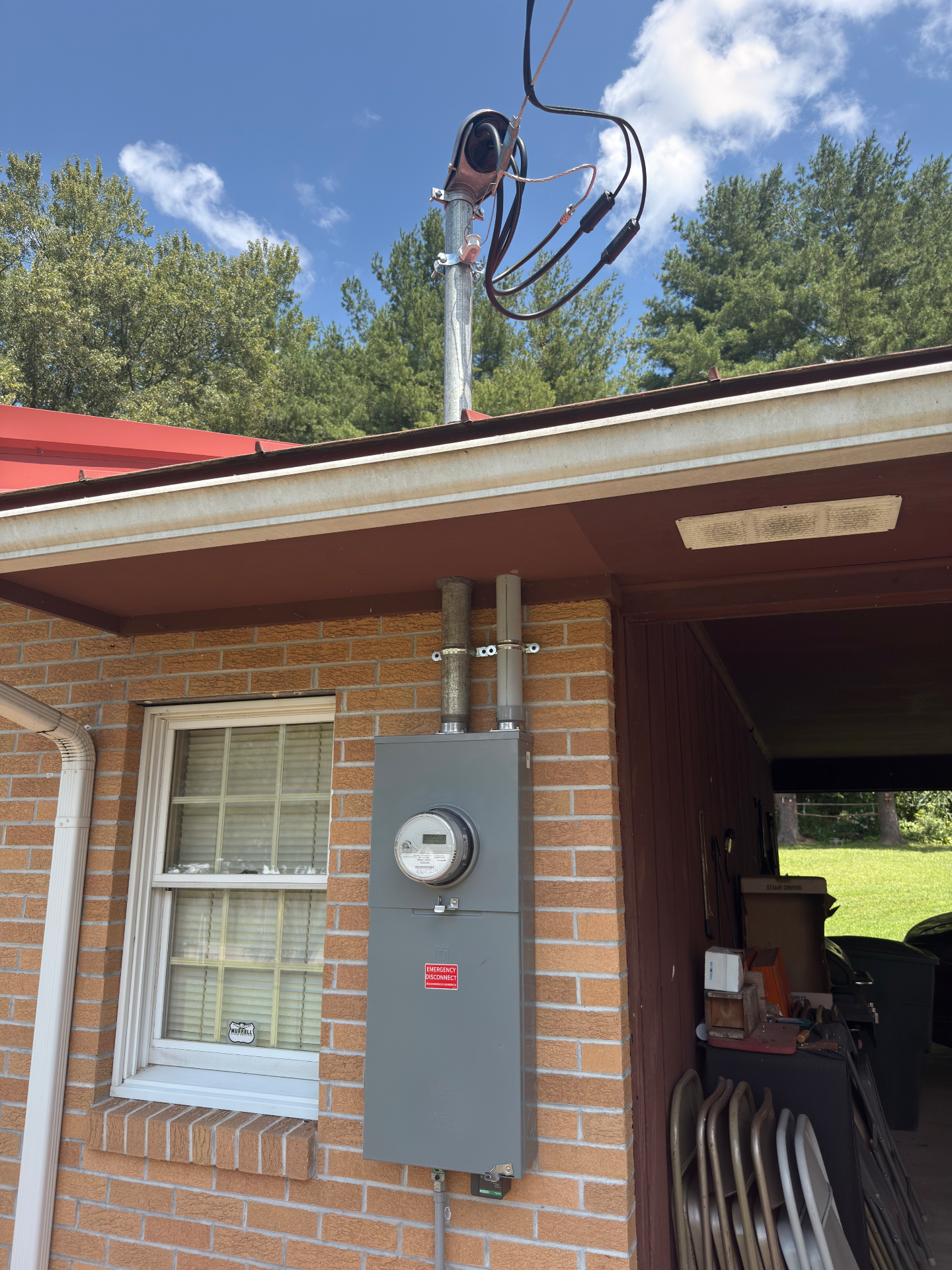 Outside electrical meter service installed on a brick home in Del Rio, Tennessee